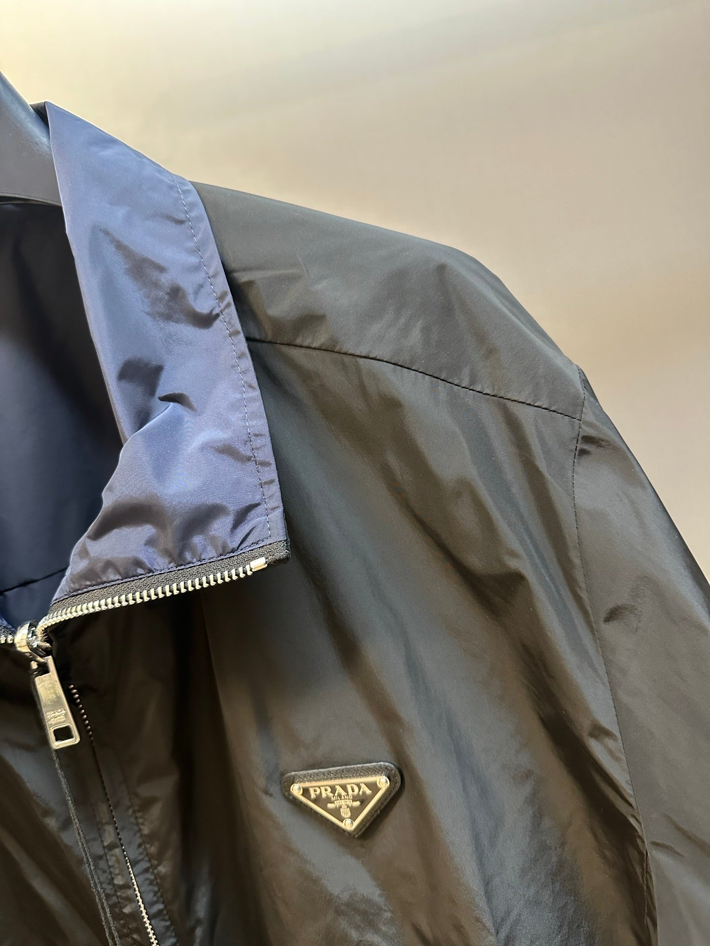 Prada long jacket sleeve with zipper pull and chest logo patch