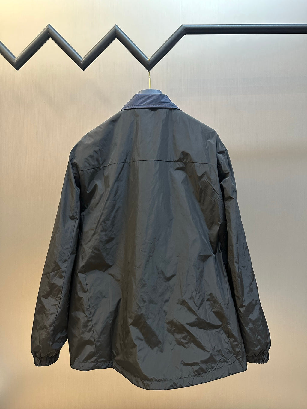 Prada long jacket, back view with hood and gathered hem