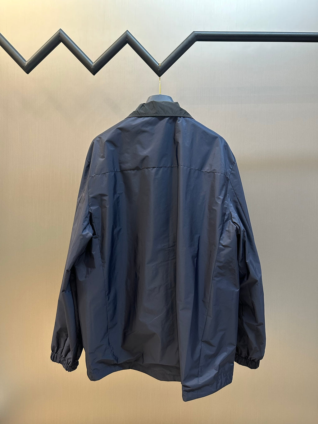 Prada long jacket, back view with hood and elastic sleeve cuffs