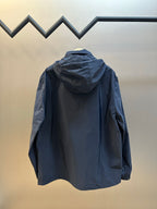 Back view: navy hooded zip jacket with loose fit and long sleeves