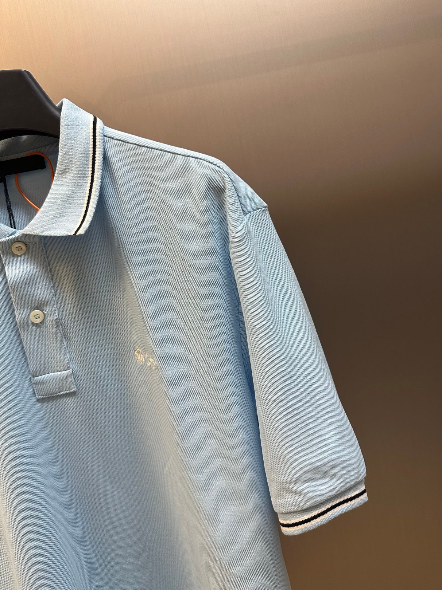 Prada light blue polo shirt sleeve and buttoned placket with small logo