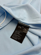 Prada light blue polo shirt fabric with size label and care tag