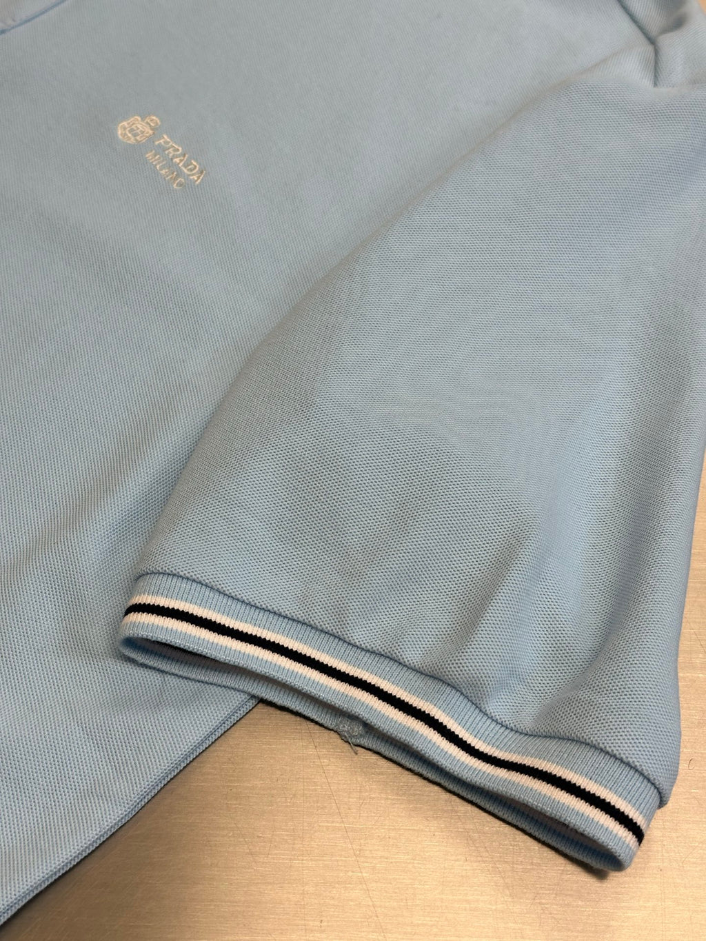 Prada light blue polo shirt hem with striped cuff trim detail