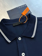 Navy polo shirt with striped collar edge, two-button placket, and Prada label