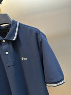 Navy Prada polo shirt with chest logo and contrast stripe trim on sleeves