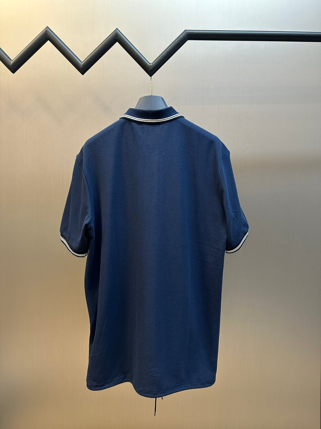 Navy Prada polo shirt back view with ribbed collar and sleeve stripe trim