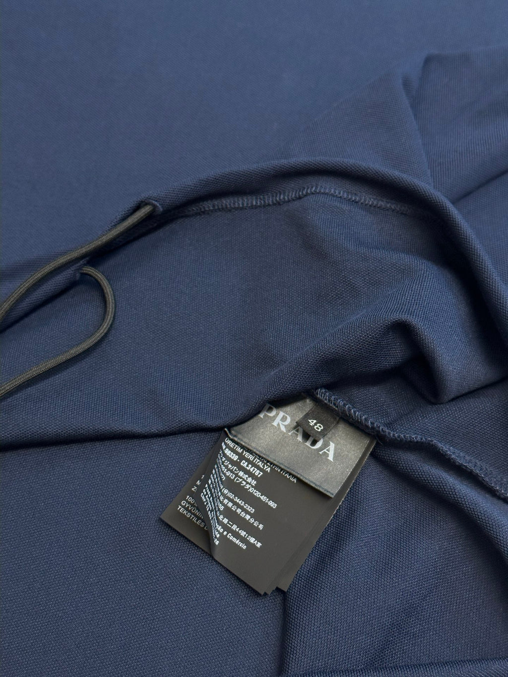 Navy polo shirt with interior neck label tag