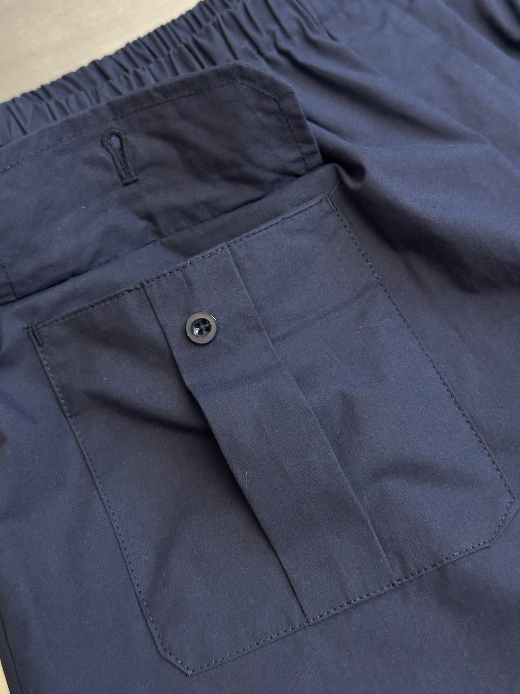 Prada navy shorts with elastic waistband and side buttoned pocket