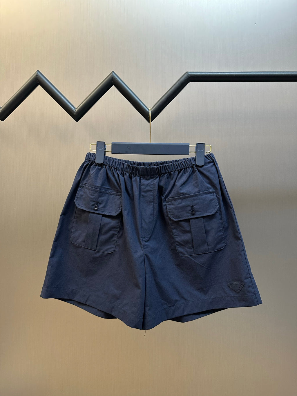 Prada navy shorts with elastic waist and two flap cargo pockets