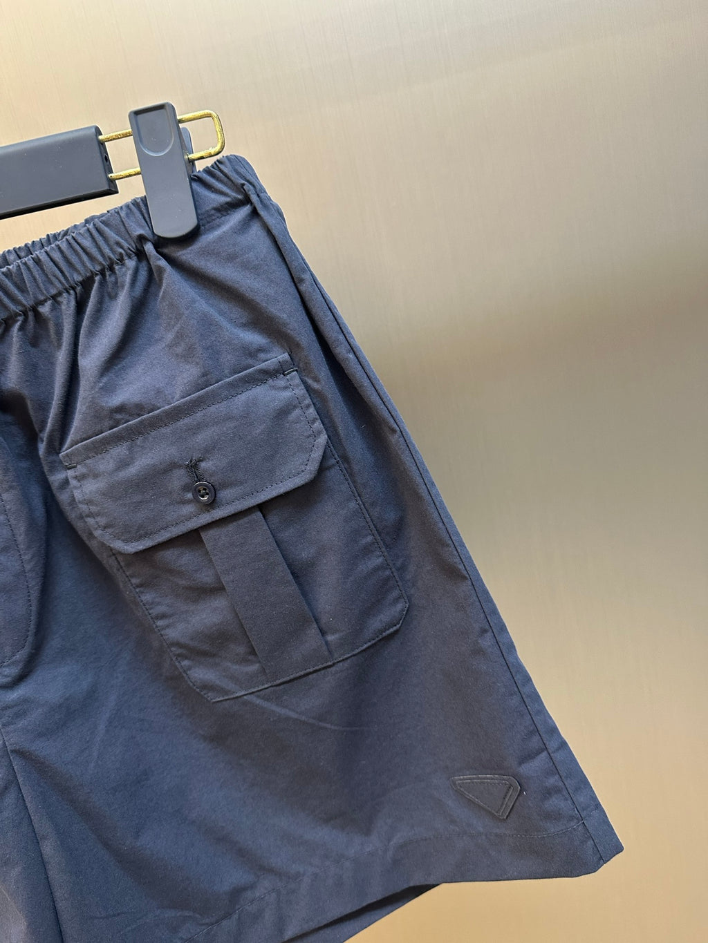 Prada navy shorts with flap pocket and logo-style triangular patch