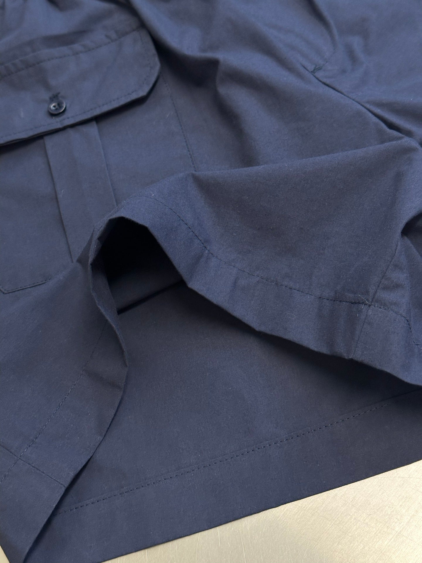 Prada navy shorts with flap pocket and interior opening