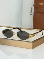 Celine sunglasses with gold-tone frame and dark gray lenses, black arms