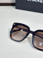 Chanel sunglasses close-up with tortoiseshell frame and tinted lenses
