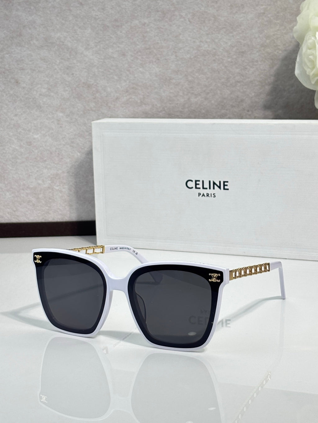 Celine square sunglasses with dark lenses, white frame front and gold-tone temples