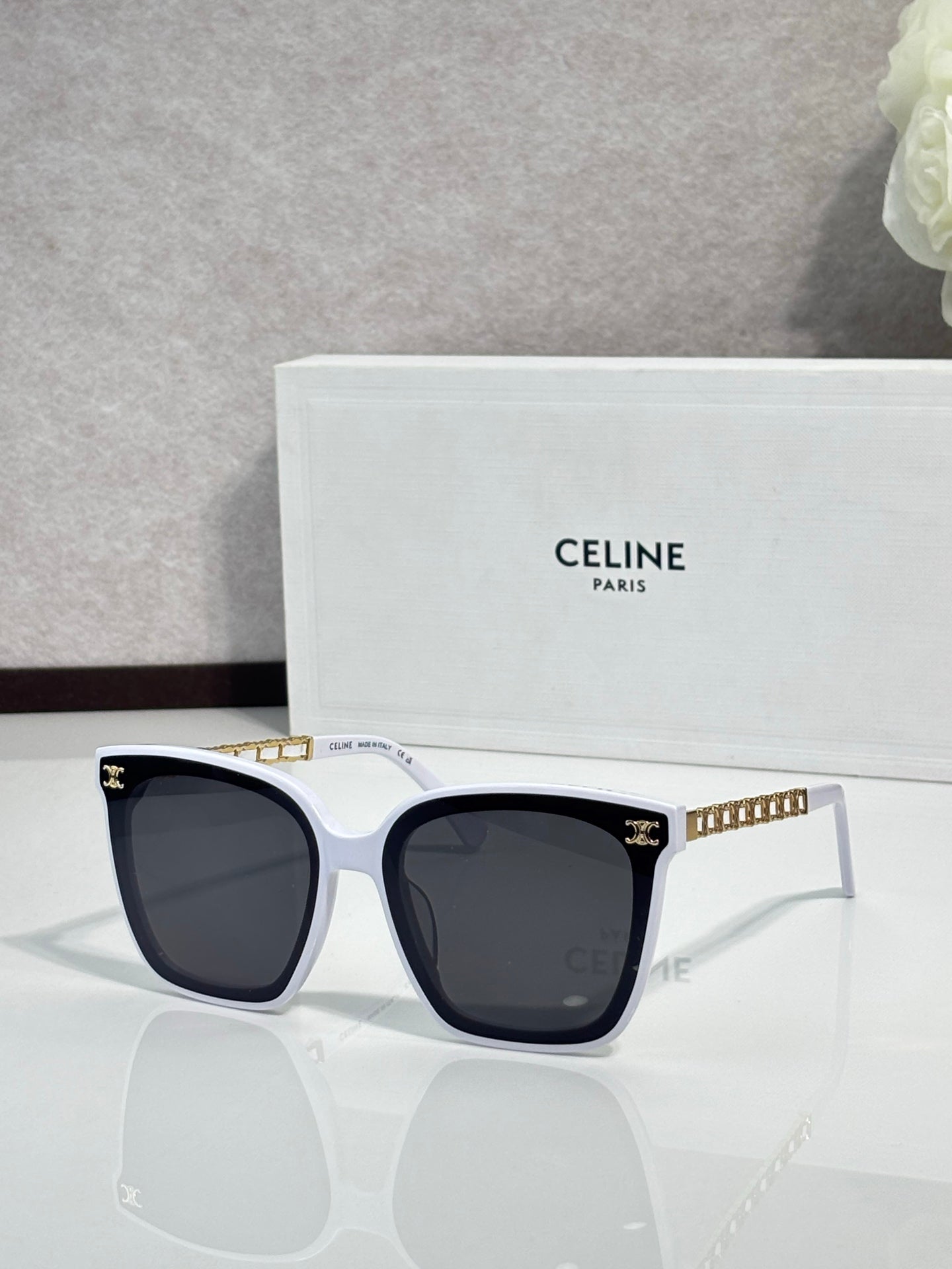 Celine square sunglasses with dark lenses, white frame front and gold-tone temples