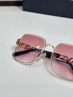 Chanel square sunglasses with pink lenses, rose-tinted frame, gold temple detail