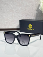 Versace sunglasses with black square frames and dark lenses, silver arms with VERSACE logo