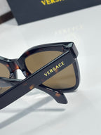 Versace sunglasses with dark tortoiseshell frames and tan lenses, gold VERSACE text on arm