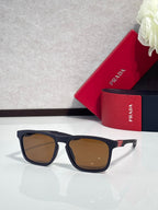 Prada square sunglasses with brown-tinted lenses and navy-blue frame, front view