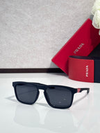 Prada square sunglasses with dark lenses and navy-blue frame, light gray temples