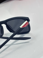 Prada sunglasses side arm with logo patch and dark lenses, profile