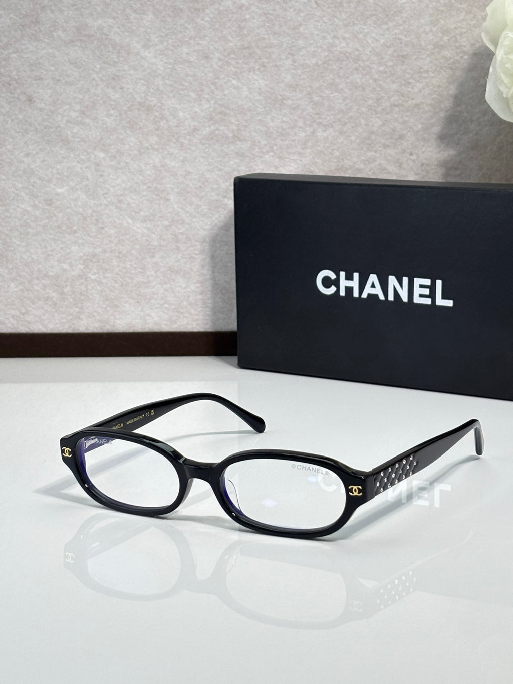 Chanel eyeglasses with dark blue round frame and clear lenses