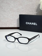 Chanel eyeglasses with dark blue round frame and clear lenses