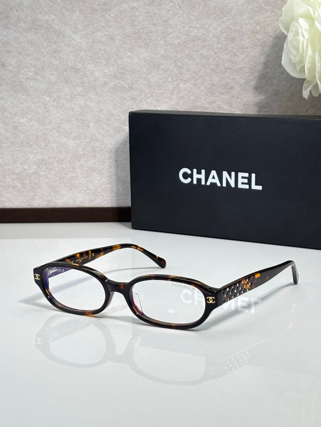 Chanel eyeglasses with tortoiseshell frame and dark temple detailing