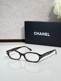 Chanel eyeglasses with tortoiseshell frame and dark temple detailing