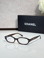 Chanel eyeglasses with tortoiseshell frame and dark temple detailing