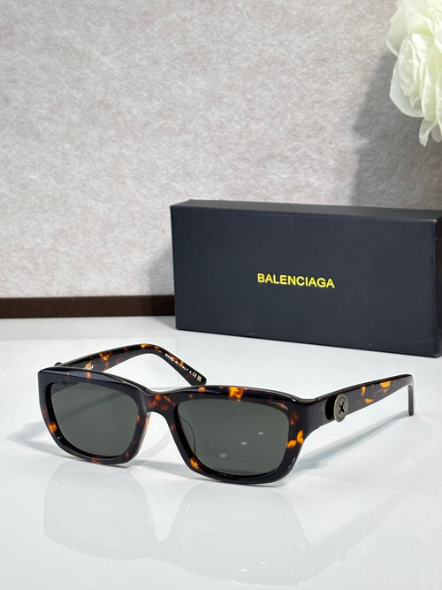 Balenciaga sunglasses with dark tortoise frame and black lenses