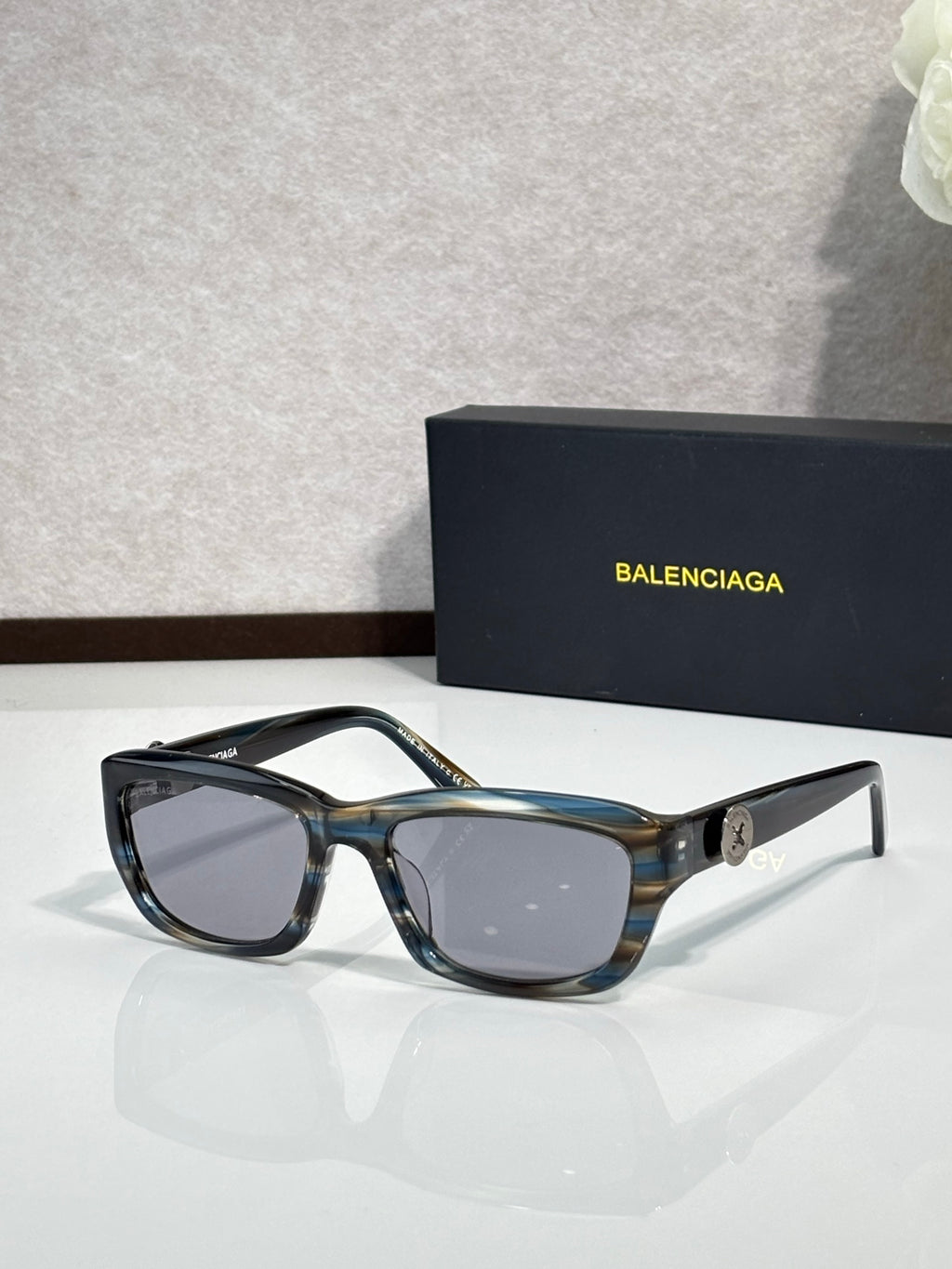 Balenciaga sunglasses with blue tortoise frame and dark lenses