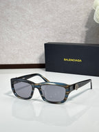 Balenciaga sunglasses with blue tortoise frame and dark lenses
