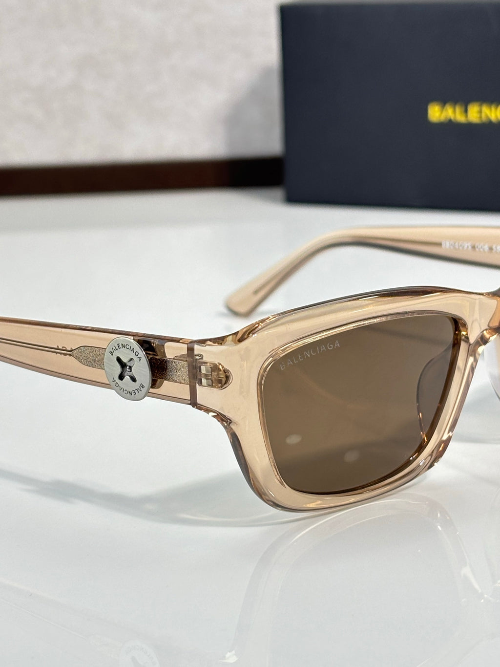 Balenciaga sunglasses with tan frame and brown-tinted lenses