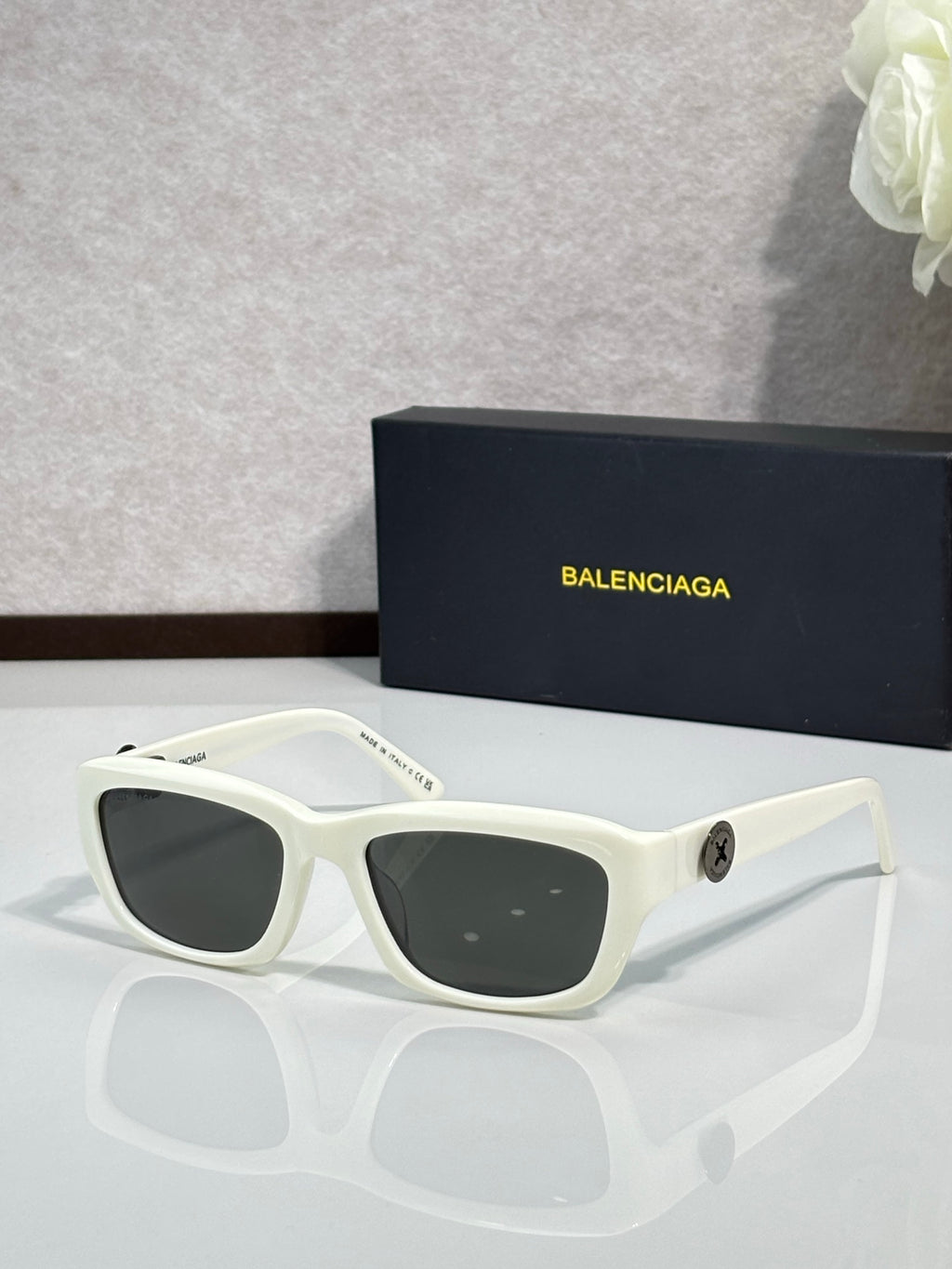 Balenciaga sunglasses with white frame and dark lenses