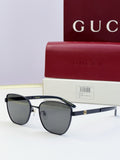 Gucci eyeglasses with black frames and dark lenses; black temples; includes Gucci case.