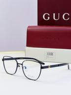 Gucci eyeglasses with black frames and clear-to-dark lenses; black temples; includes Gucci case.