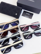 Assorted Chanel sunglasses with mixed frames and tinted lenses, displayed with a dark case
