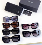 Assorted Chanel sunglasses with black, brown, pink, and gray frames and tinted lenses
