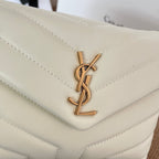 Saint Laurent YSL logo plaque on quilted light cream leather bag