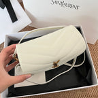 Saint Laurent quilted shoulder bag with gold-tone YSL clasp, light cream leather