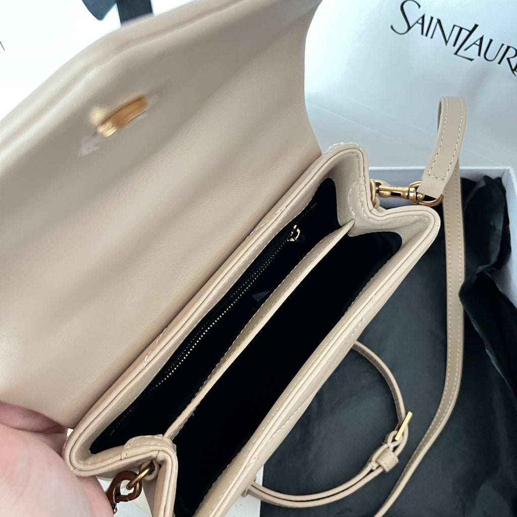 Beige YSL shoulder bag open view with lining and inner pocket