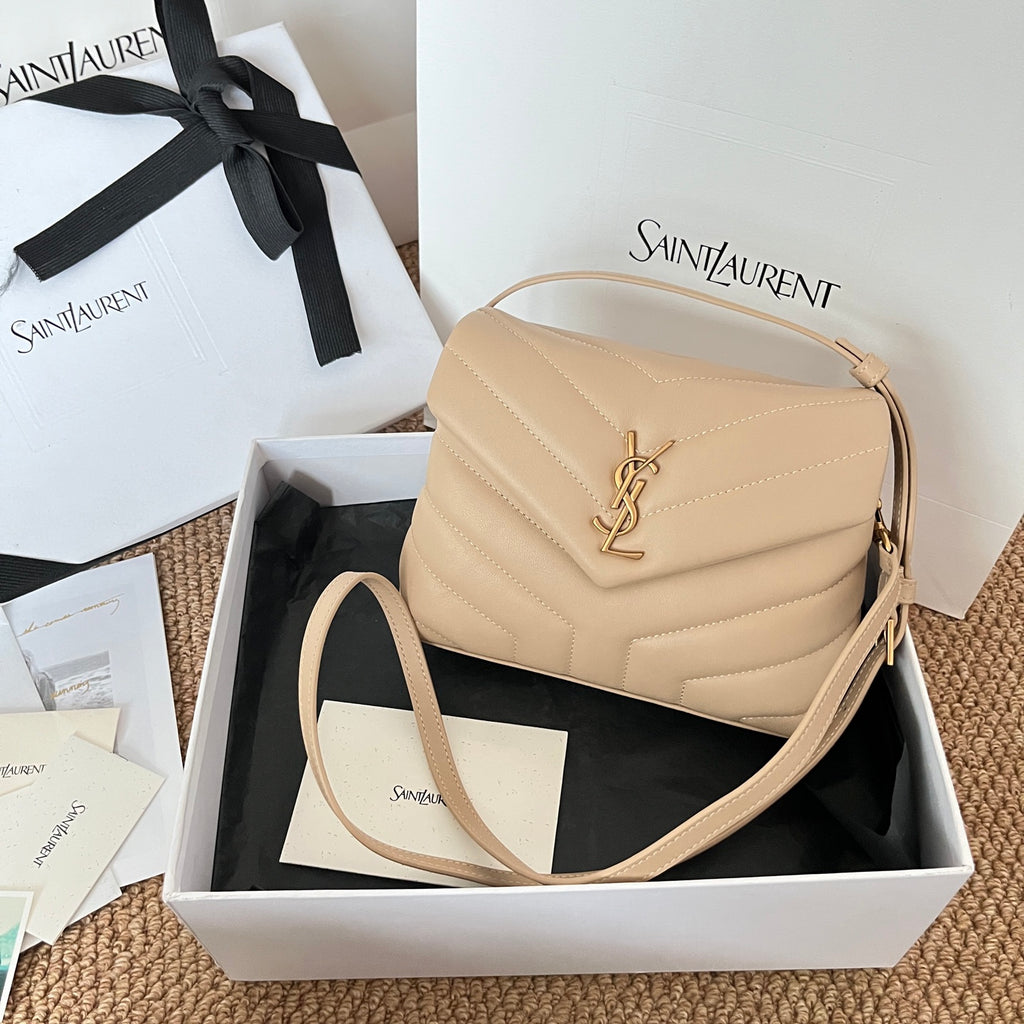 Beige quilted YSL shoulder bag with front YSL logo and crossbody strap