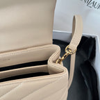Beige YSL shoulder bag strap with gold hardware and stitched trim