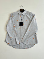 Light blue striped button-up shirt with orange dog embroidery, front view on hanger