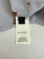 Louis Vuitton shirt fabric label on light blue striped shirt with orange dog embroidery