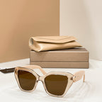 Bvlgari cat-eye sunglasses with gold frames and dark brown lenses