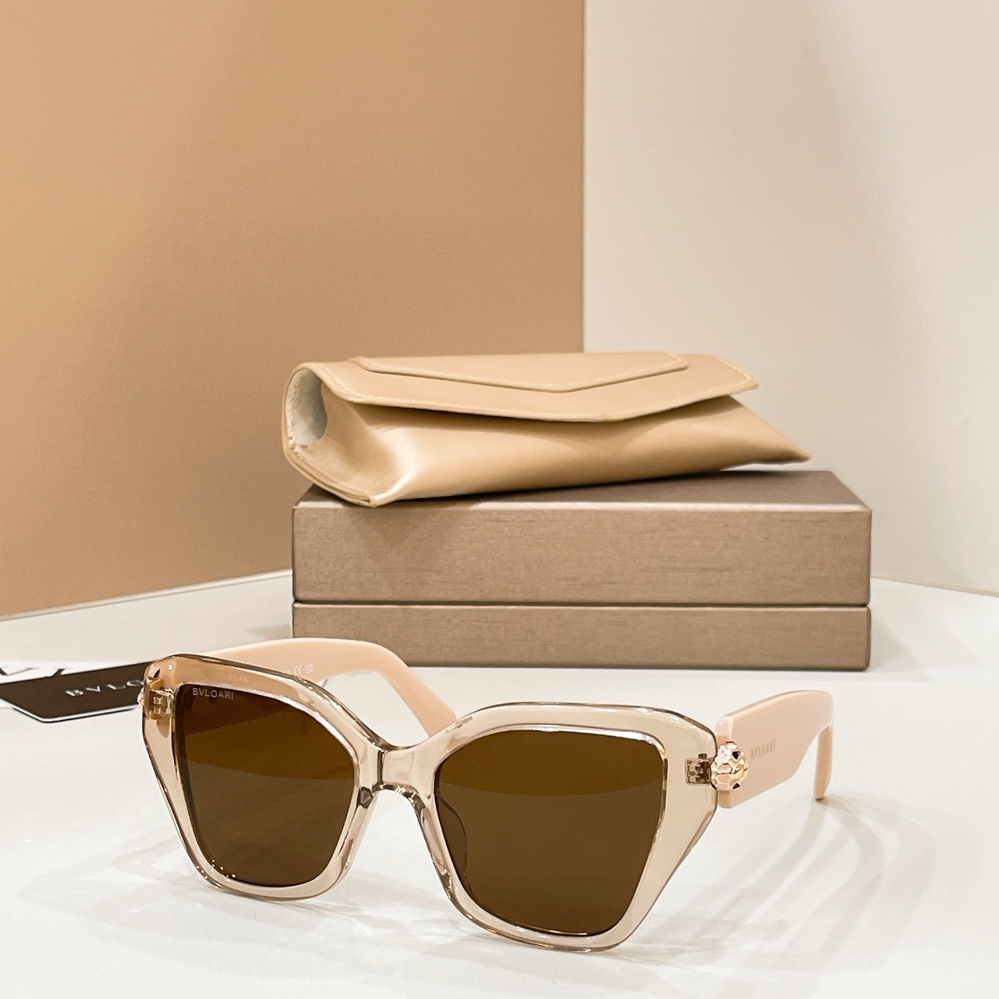 Bvlgari cat-eye sunglasses with gold frames and dark brown lenses