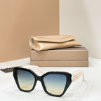 Bvlgari cat-eye sunglasses with black frames and blue-tinted lenses