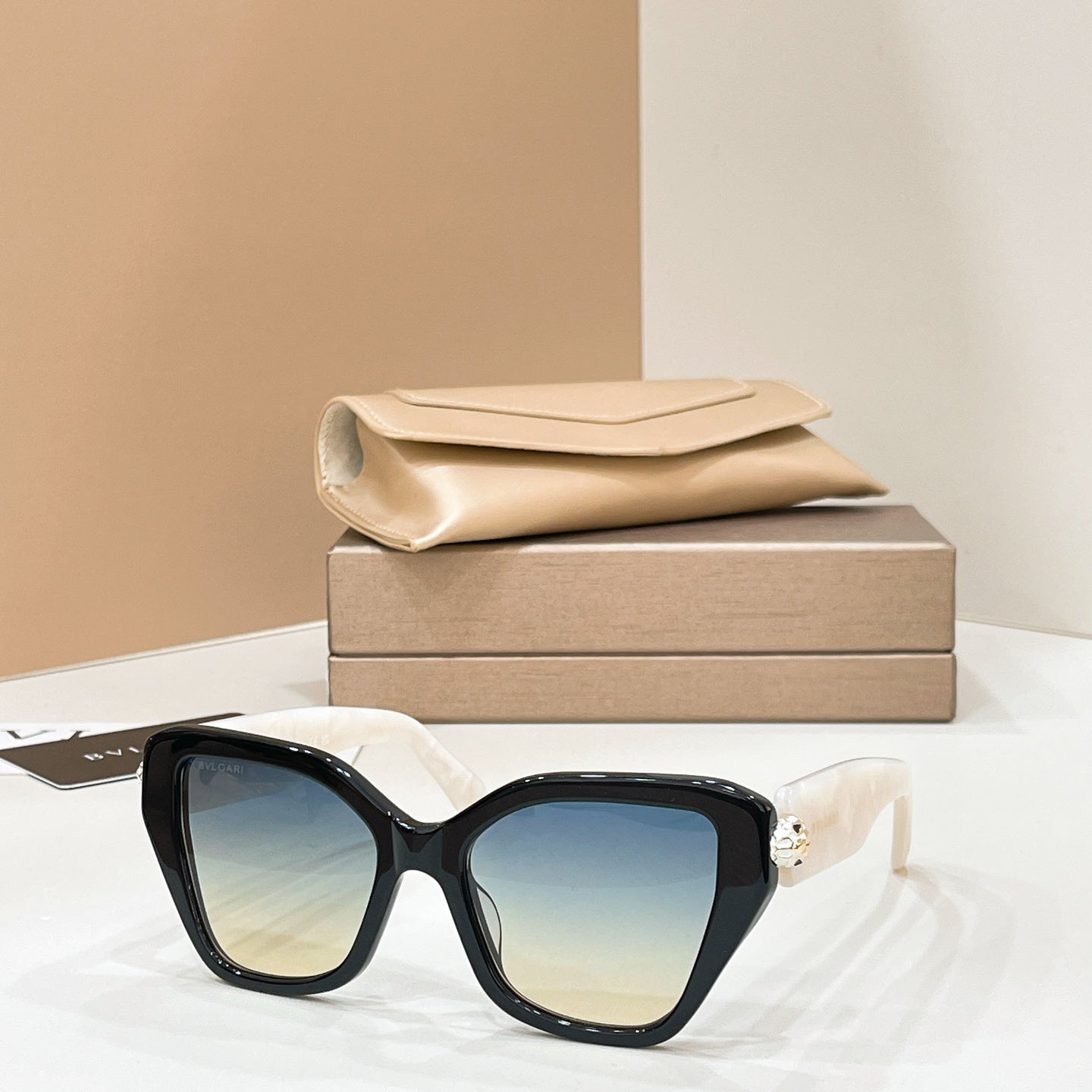 Bvlgari cat-eye sunglasses with black frames and blue-tinted lenses